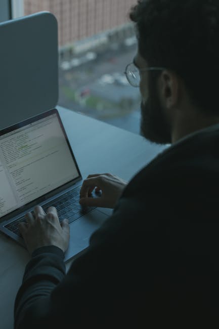 developer typing secure code lock icon