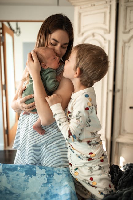older sibling meeting newborn family at home