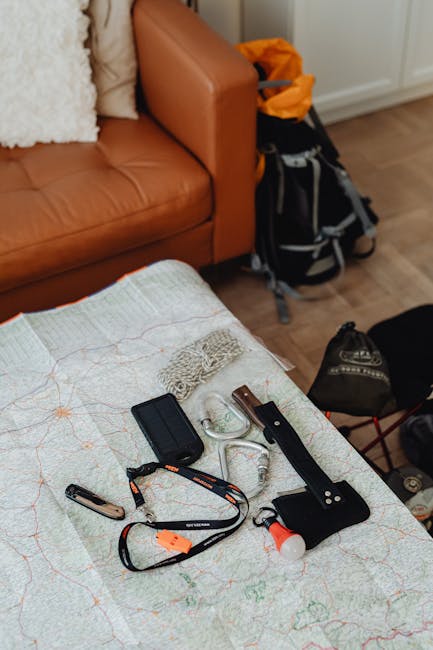 Essential hiking tools and map displayed in a cozy indoor setting, ready for adventure.