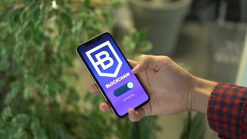 hands holding smartphone with trading app padlock cybersecurity