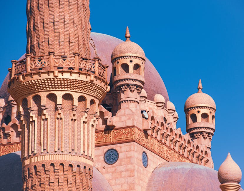 Intricate architecture of the Sahaba Mosque in Sharm El Sheikh under a clear blue sky.