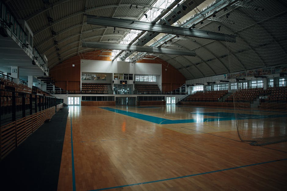 stadium interior converted to community sports performance center training hall sustainable retrofit