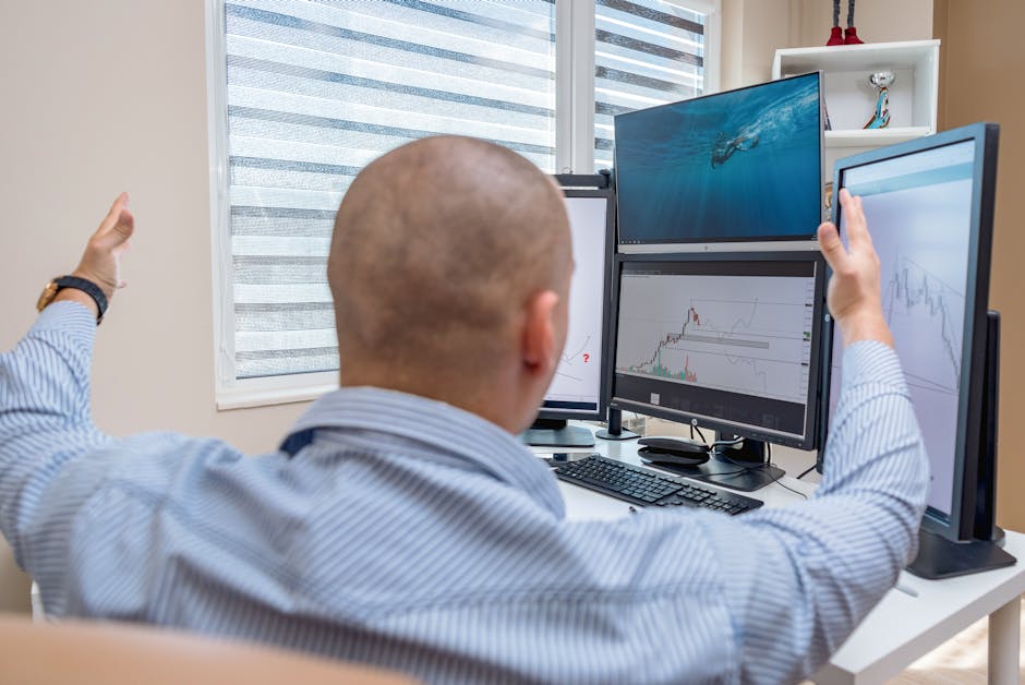 cybersecurity analyst monitoring logins multiple monitors