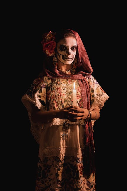 A woman in traditional dress celebrating Dia de los Muertos in Mérida, Mexico.