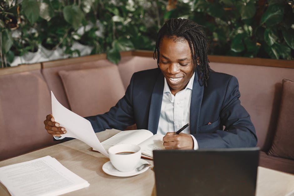 digital nomad negotiating salary laptop cafe documents