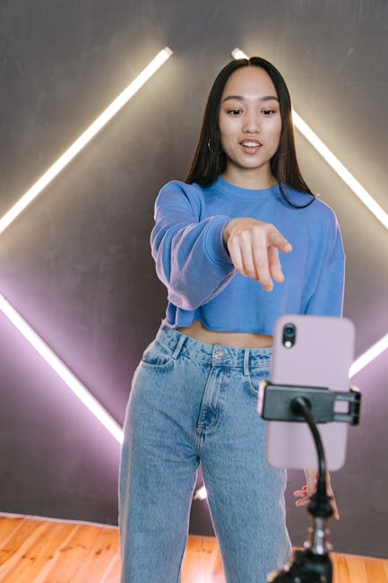 female creator filming short-form video with ring light smartphone studio