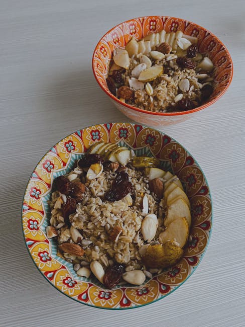 Colorful bowls of oats, fruits, and nuts offer a healthy breakfast option.