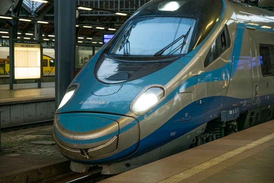 A sleek, modern high-speed train captured at Wrocław train station, showcasing contemporary transportation.