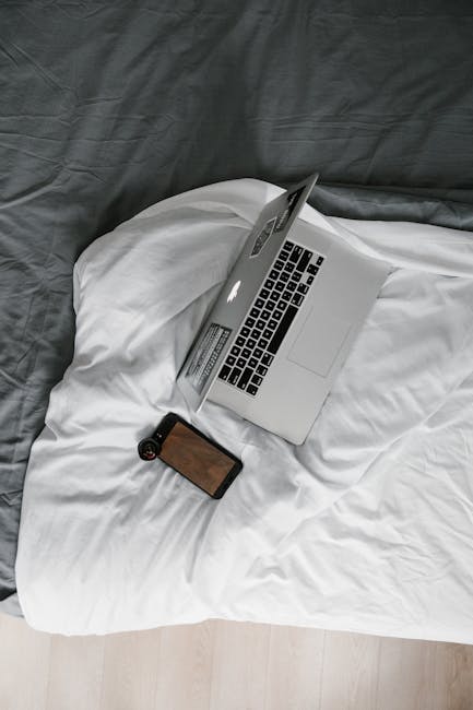 comparing travel prices on laptop and smartphone