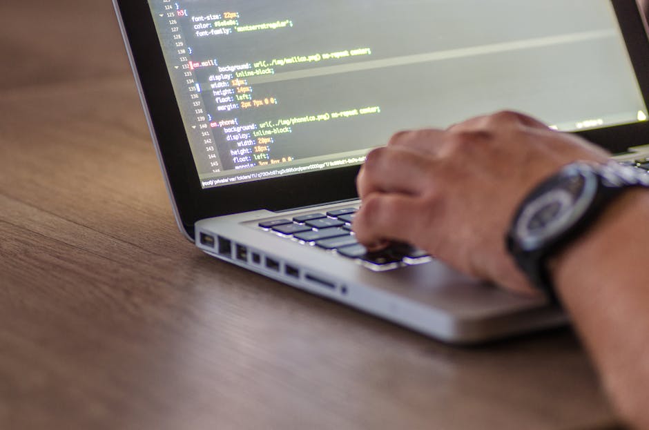 developer laptop code LLM model Arabic text on screen