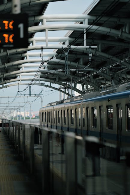 A sleek train at a modern metro station, showcasing urban travel infrastructure.