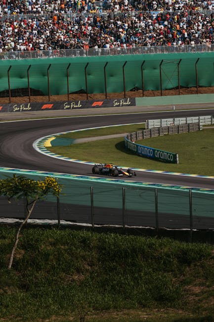 A thrilling Formula 1 race car speeds through the iconic Interlagos Circuit in São Paulo, Brazil.