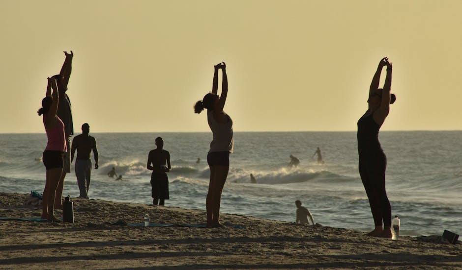 beach yoga group Abu Dhabi sunset