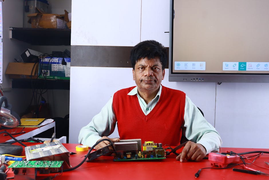 technician repairing inverter board electronics workshop