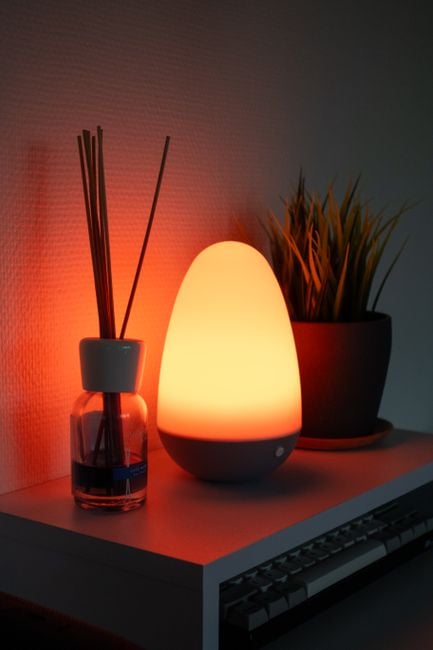 modern smart aroma diffuser on table with soft lighting