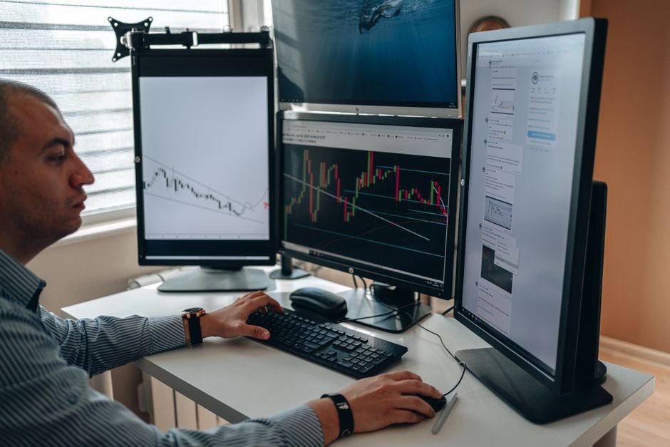 security researcher analyzing email on multiple monitors