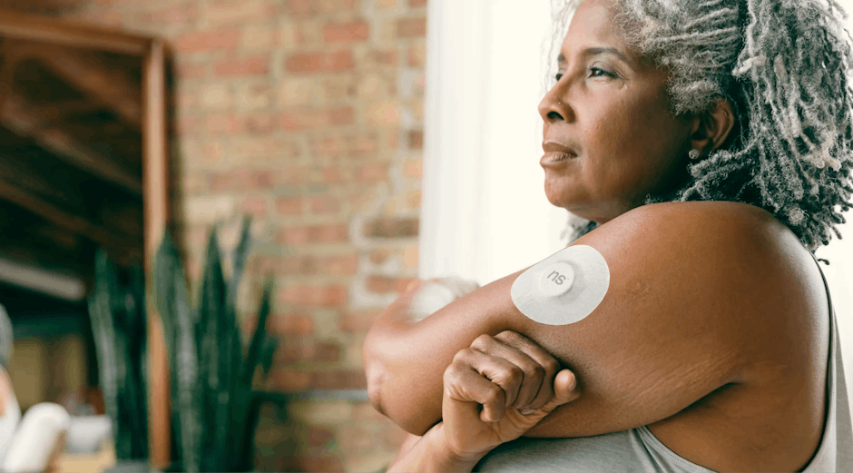 continuous glucose monitor wearable on arm CGM sensor lifestyle