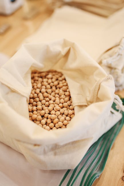A reusable sack filled with chickpeas, promoting zero waste and sustainable shopping.
