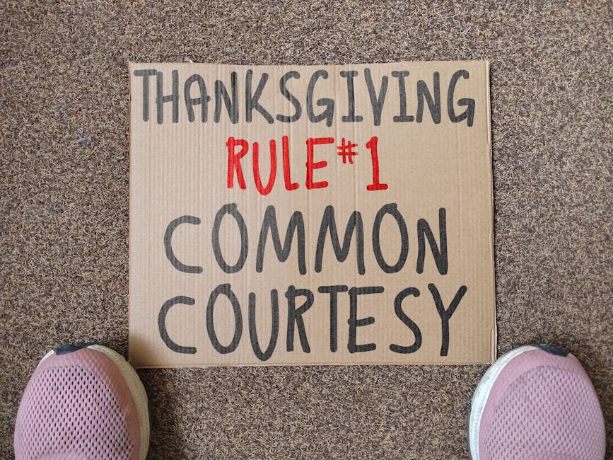 Cardboard sign with Thanksgiving Rule #1 written, promoting common courtesy.