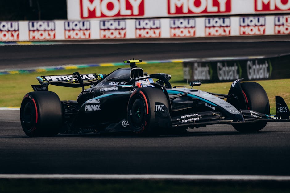 High-speed Formula 1 race car on track at Interlagos, capturing the thrill of motorsports.