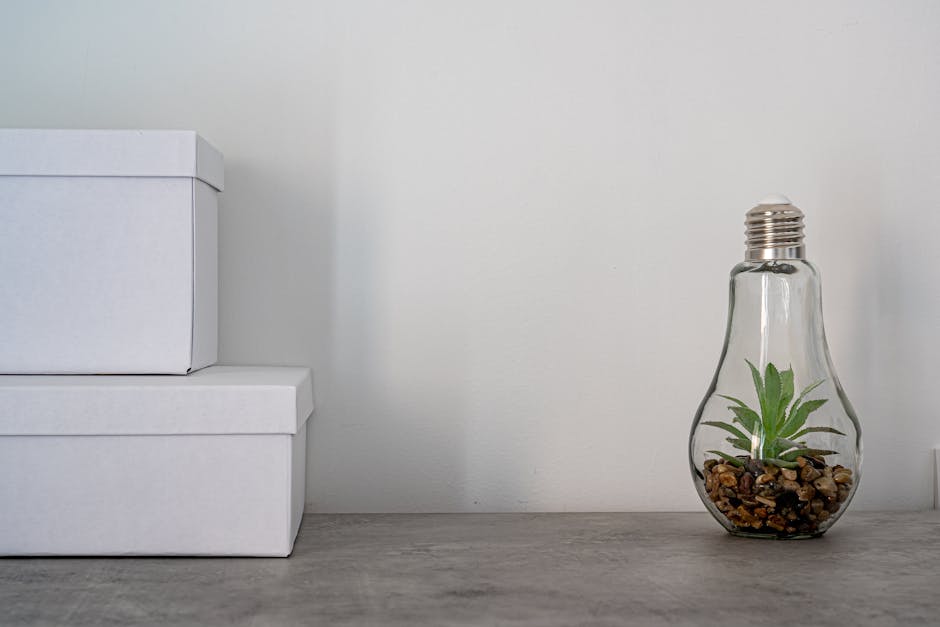compact desk floral arrangement orchid and small succulent minimalist office