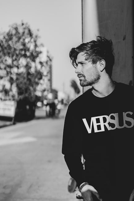 Stylish black and white portrait of a male model in urban Los Angeles setting.