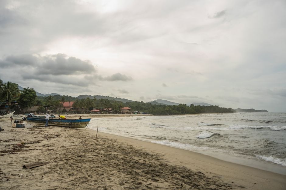 Palomino beach Colombia local boats palm trees sustainable travel