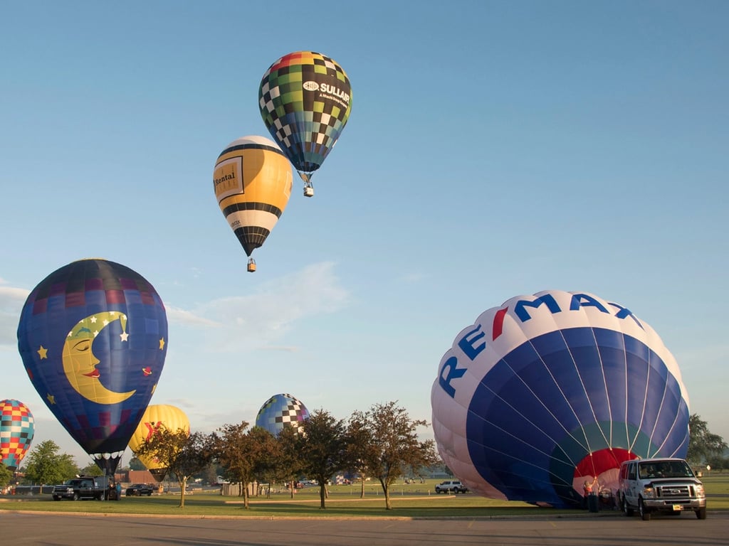 Hot air balloon ascending into the morning sky