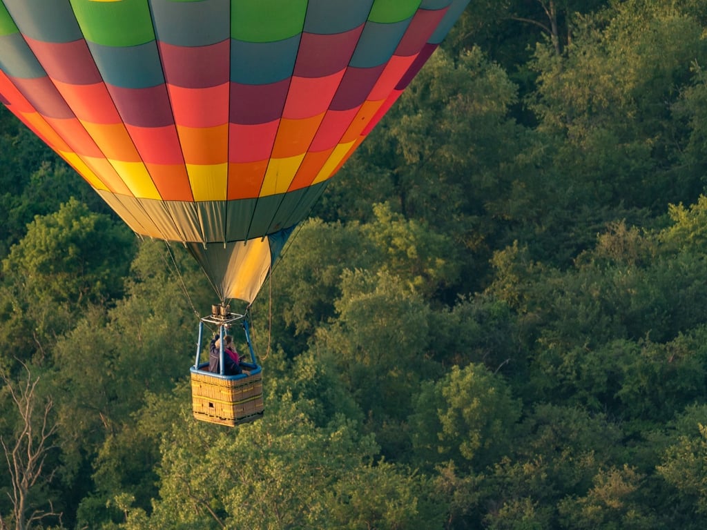 Passengers enjoying a hot air balloon ride