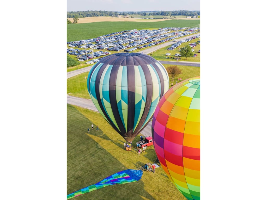 Hot air balloons parked on the launch field