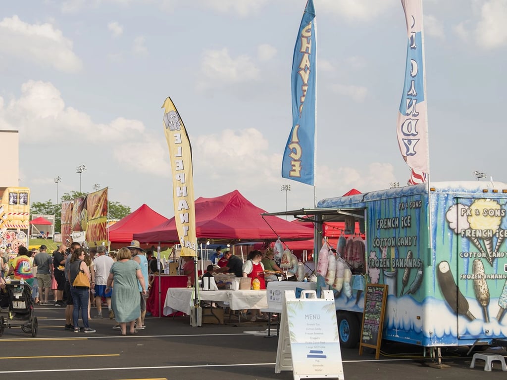Food vendors serving delicious festival treats