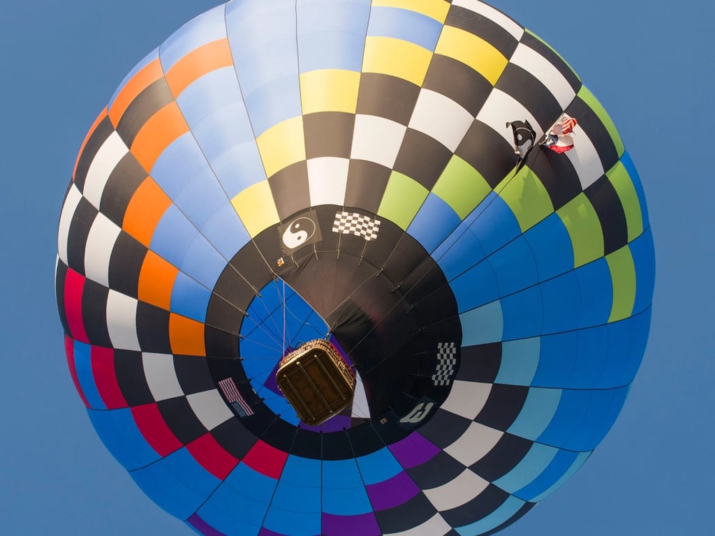 Looking up at a colorful balloon envelope
