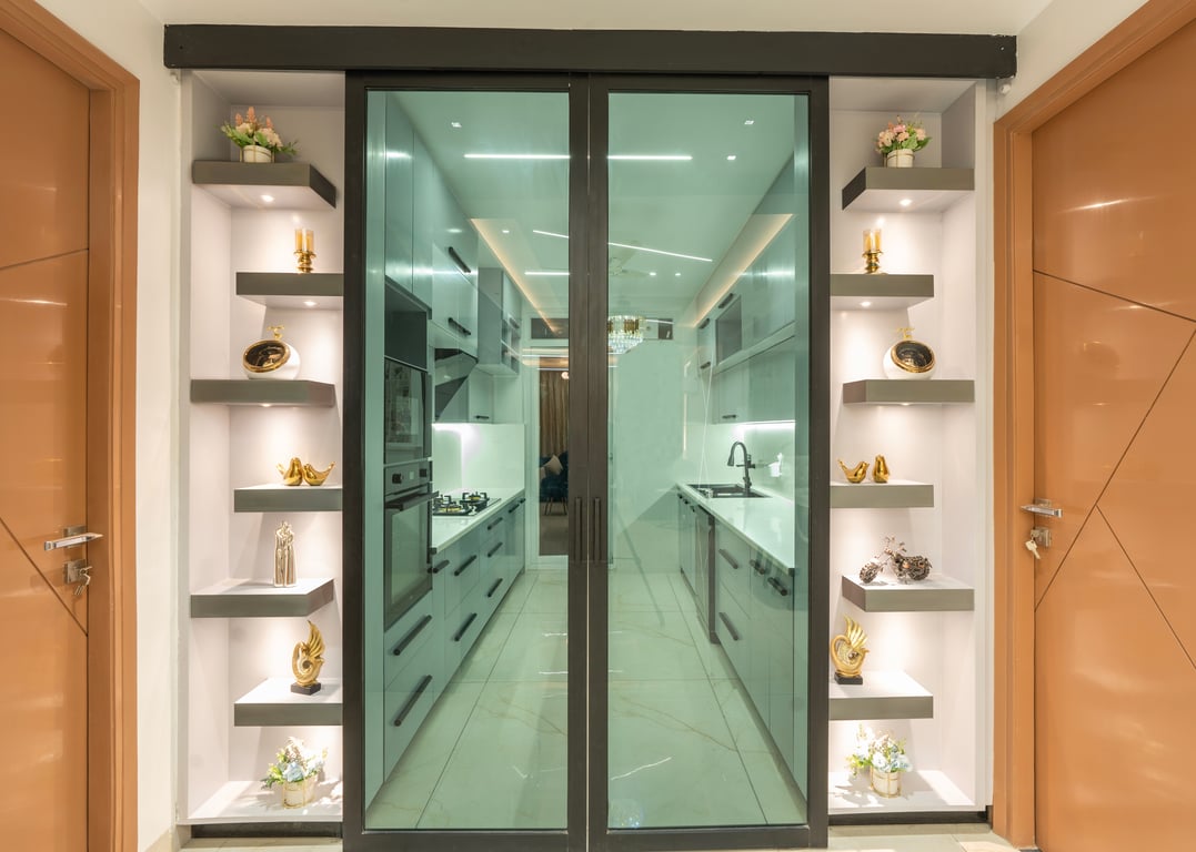 Glass entry into a white modular kitchen