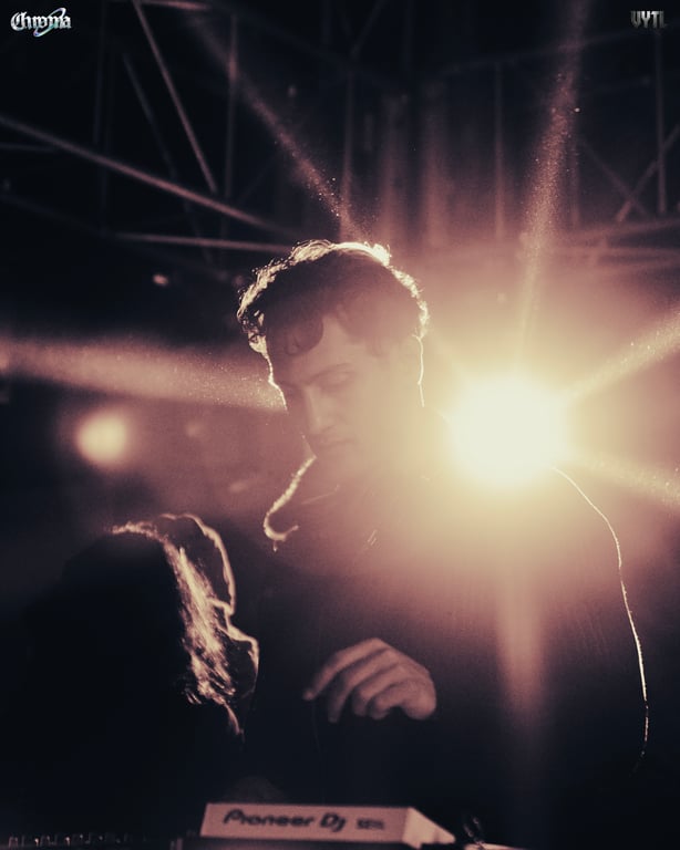 Backlit portrait of a performer at the decks