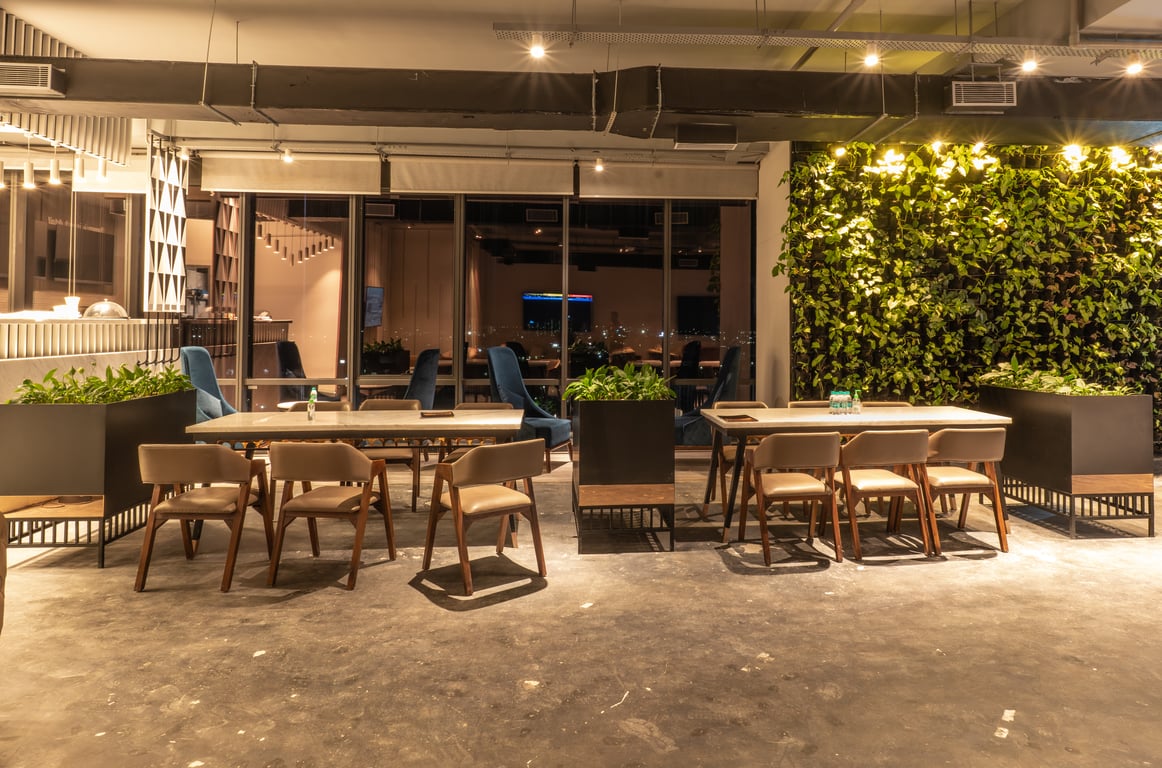 Outdoor terrace dining area at night