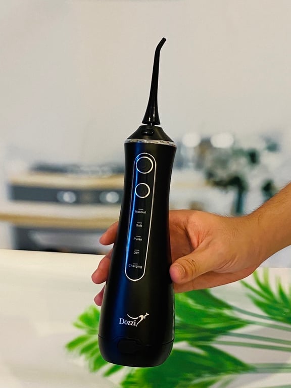 MÁY TĂM NƯỚC CẦM TAY DOZZI