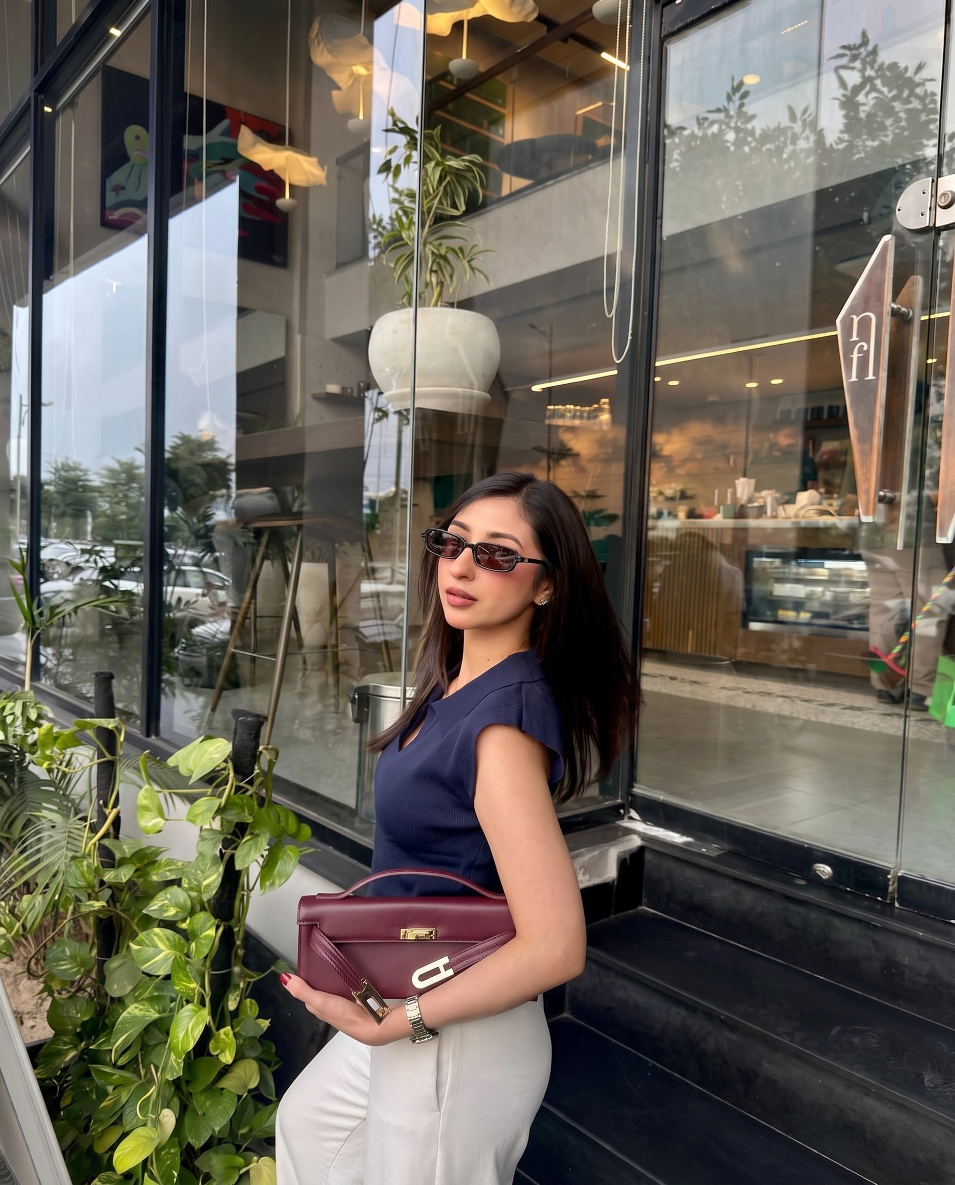 Rida Mirza wearing Ormont № 04 Black · brown lens