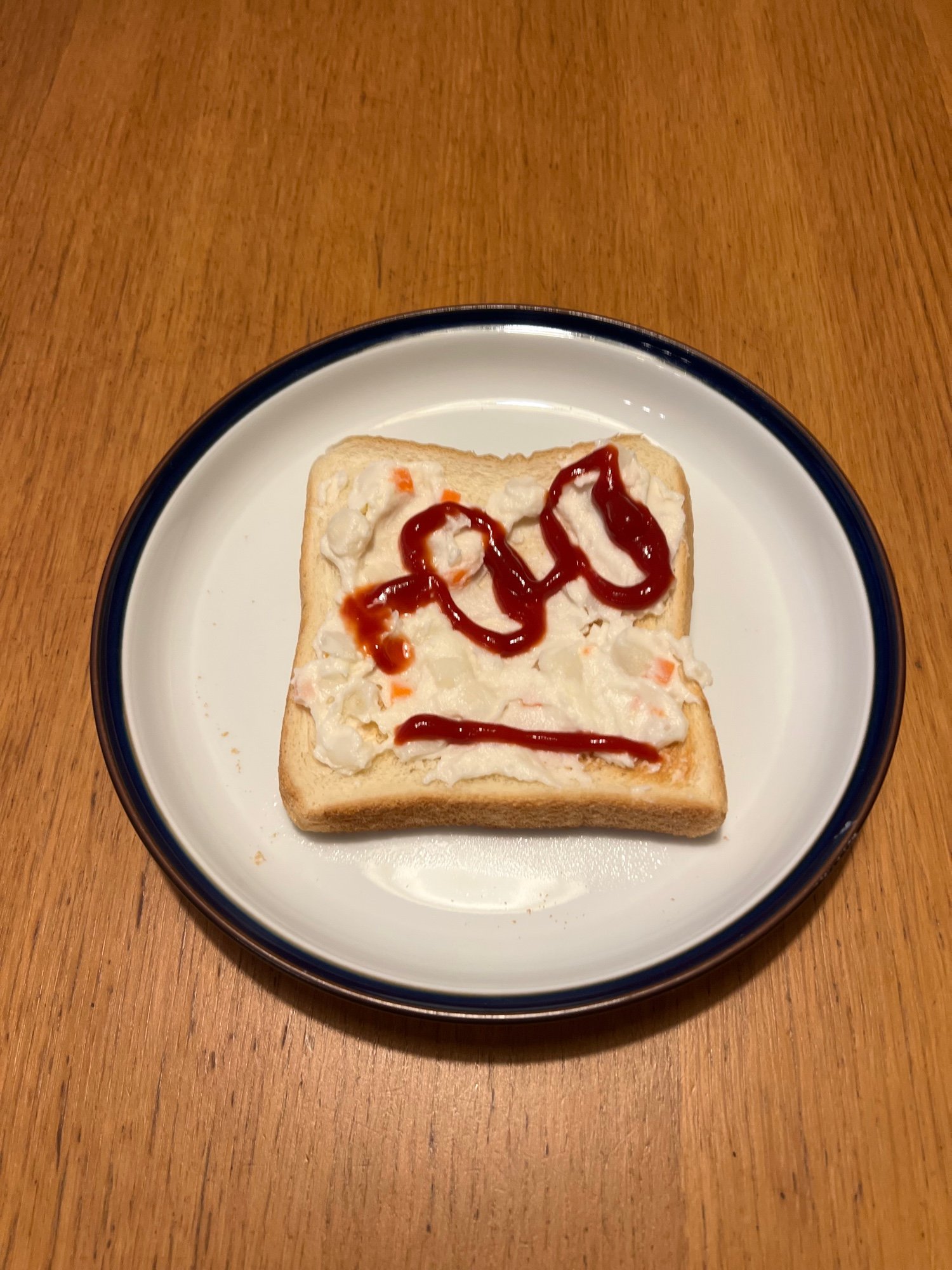 Potato salad face on bread