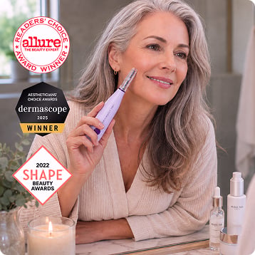 Woman holding the SonicSmooth Pro+ device with award badges