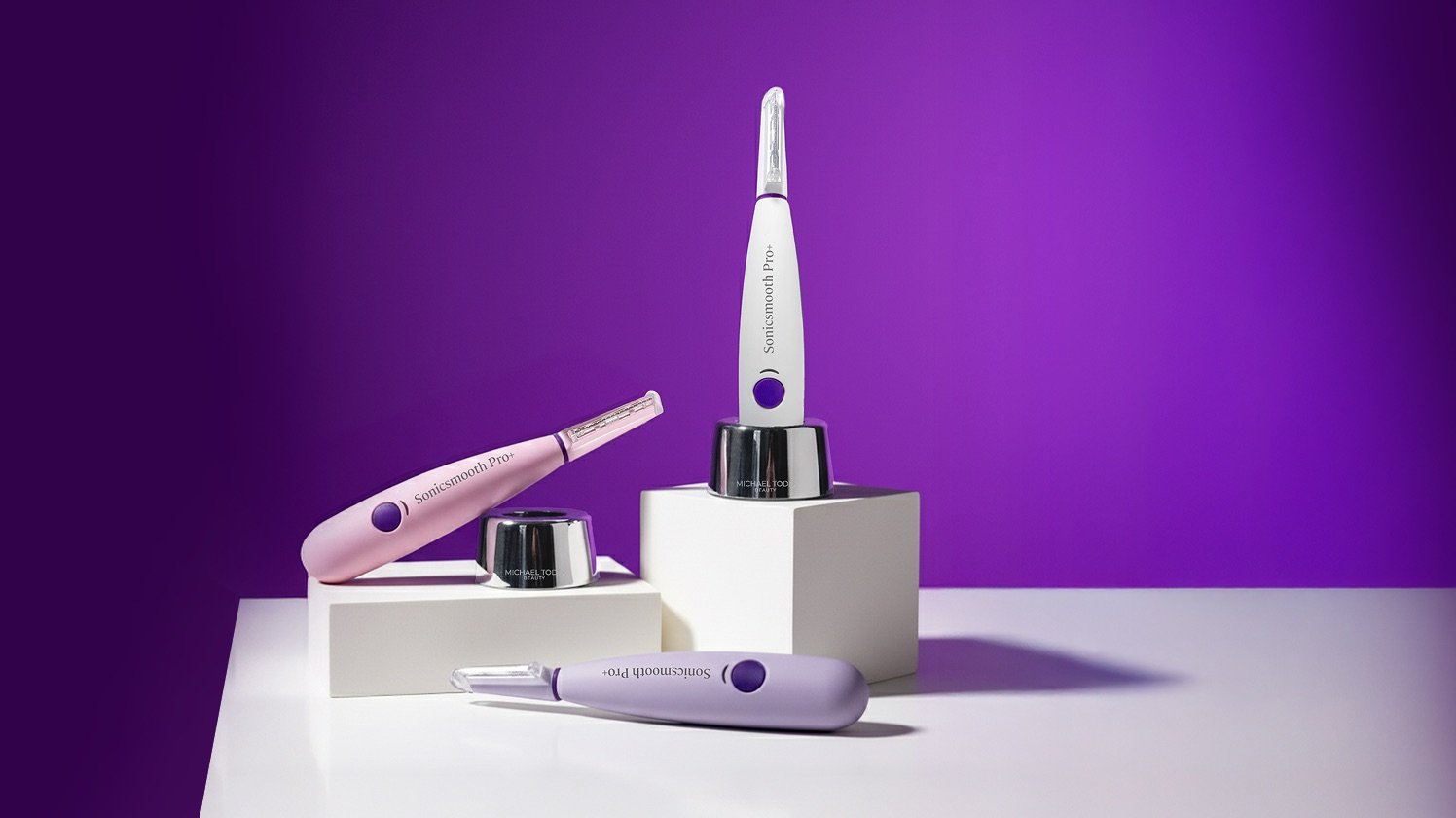 SonicSmooth Pro+ dermaplaning devices on a purple background