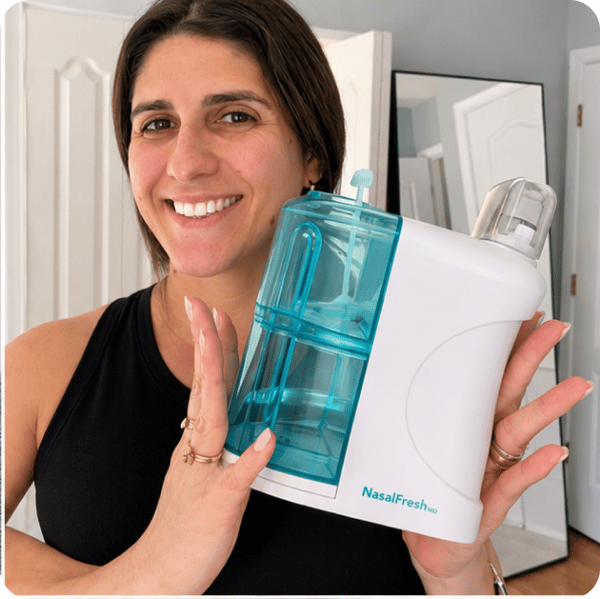 A customer holding NasalFresh MD