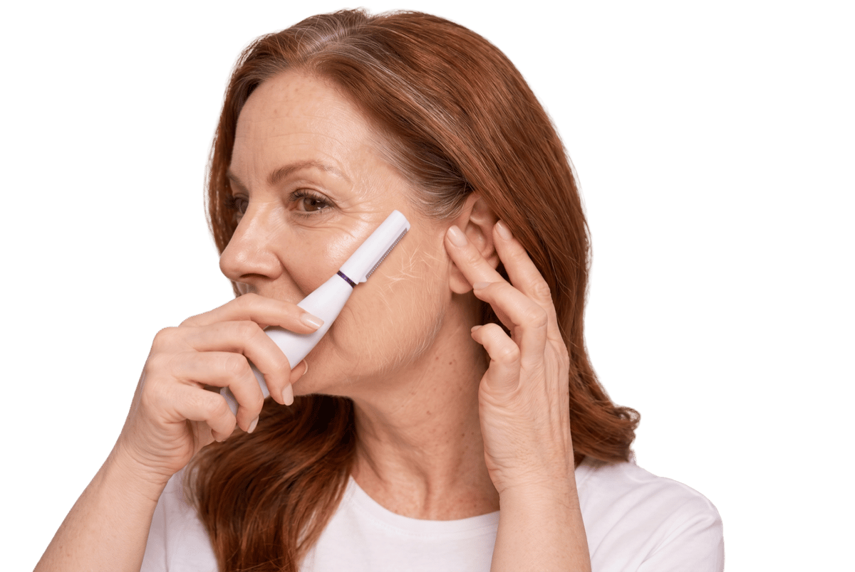 Woman using the SonicSmooth Pro+ device on her cheek