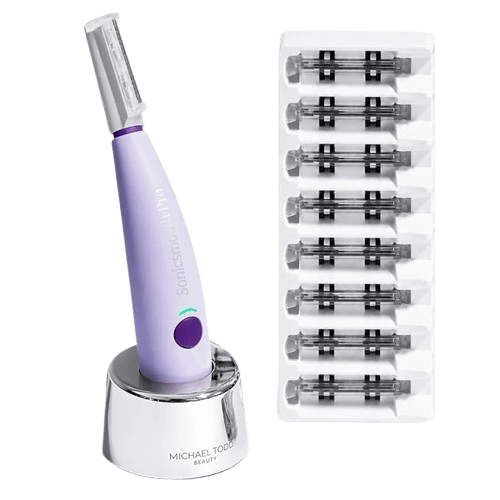 SonicSmooth Pro+ device on its charging cradle beside a strip of dermaplaning tip refill cartridges