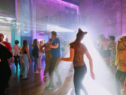 Costume dance party with bright lights