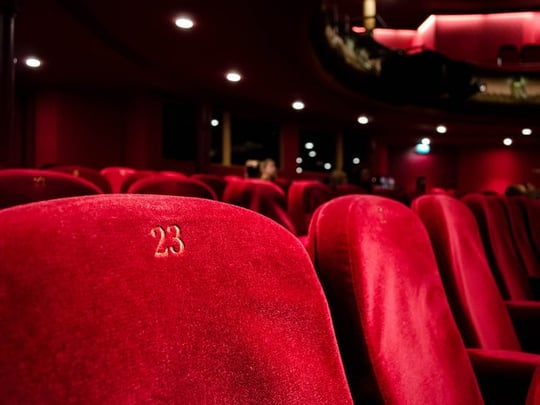 Red numbered seats at a theatre