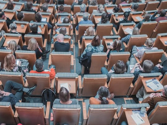 Individuals in busy conference