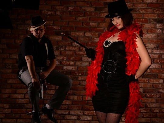 Man and woman in cabaret outfits