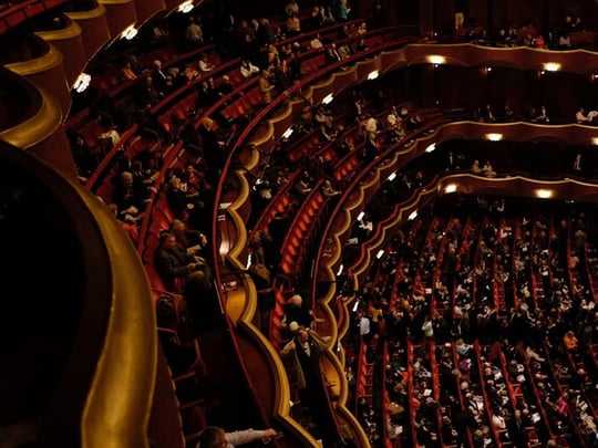 Audience sitting in a performance theatre