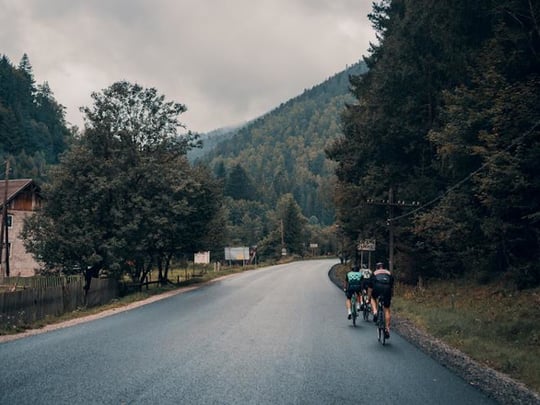 Group cycling up mountain