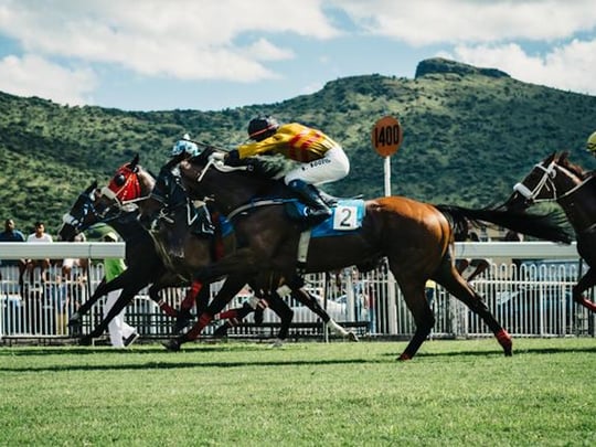 Colorful jockeys in horse race